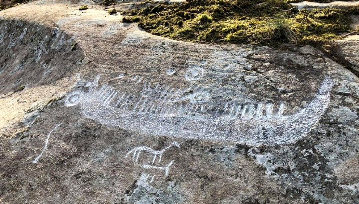 Bronze age petroglyphs ancient rock carvings landscape Norway ocean