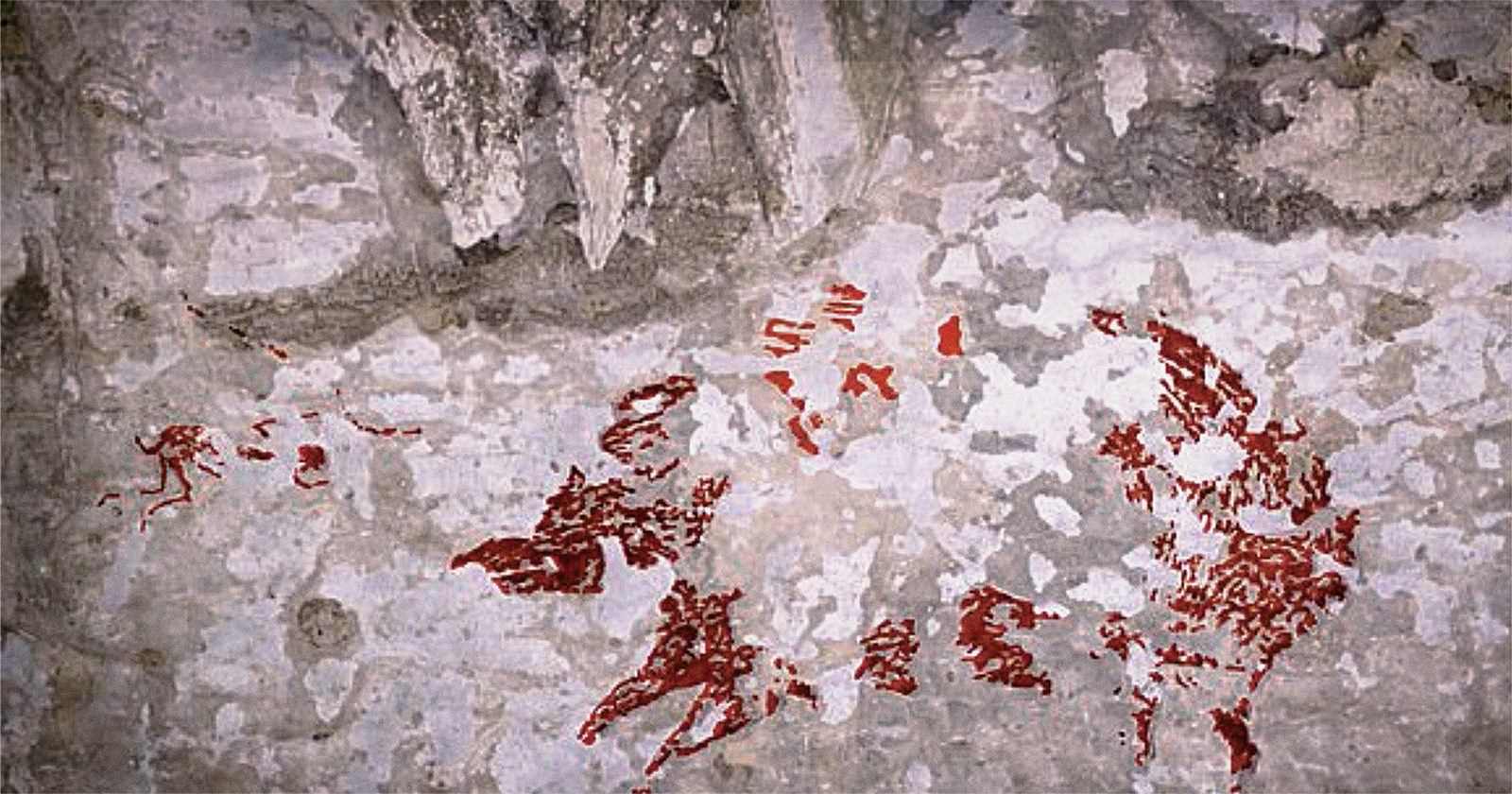 Indonesia sulawesi rock art human-like hunters fleeing mammals dated 44,000 years old cave art species