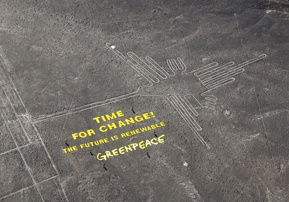 Greenpeace protest with message at Nazca lines in Peru