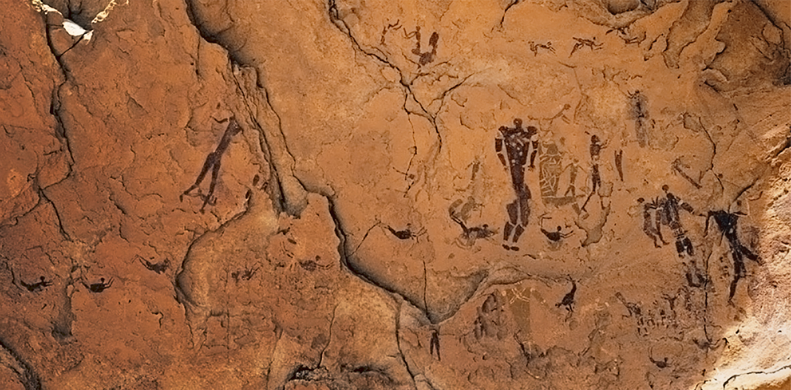 Rock art in the Cave of Swimmers, showing art in the Wadi Sura style from between about 6100-4800 BCEBradshaw Foundation