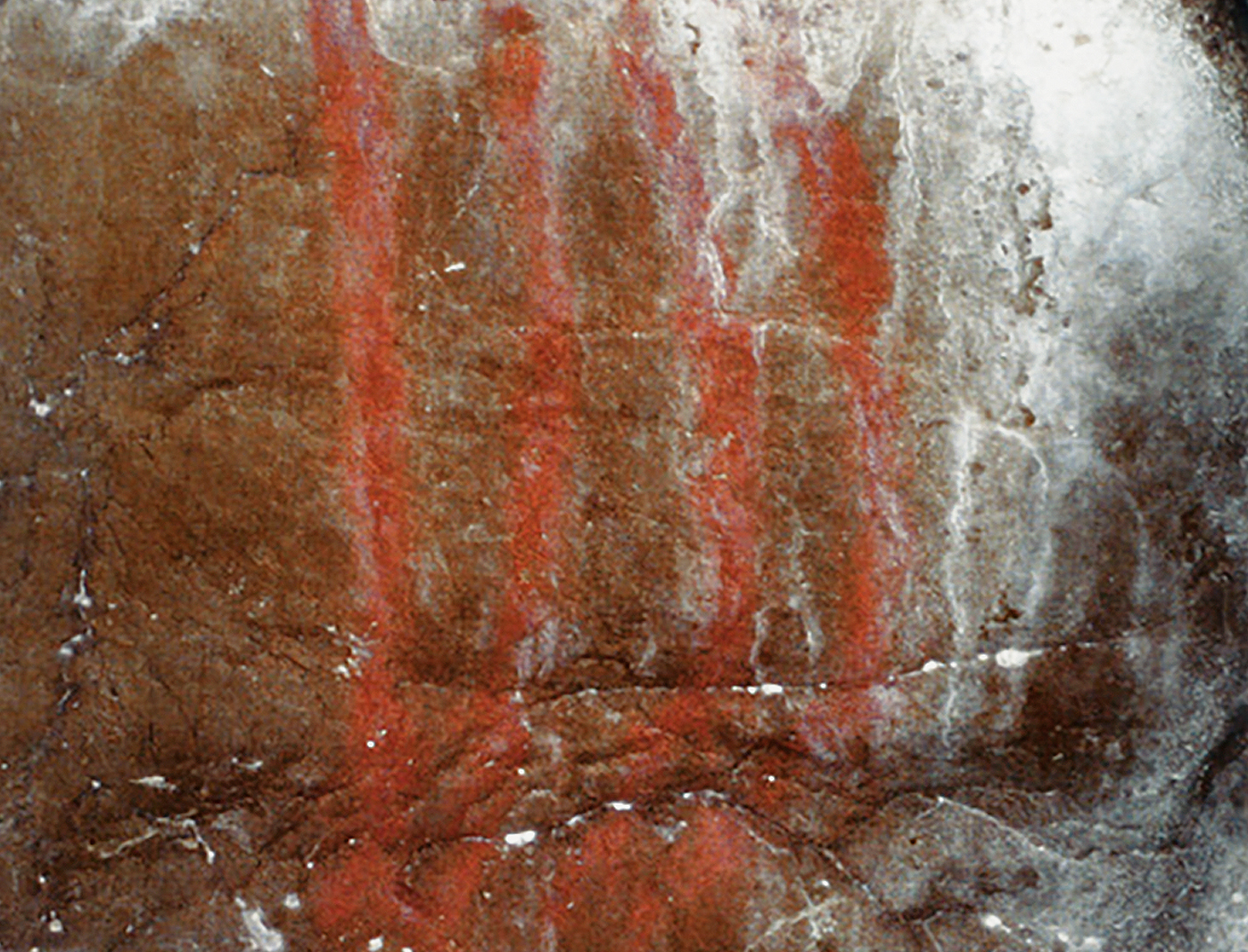 Red bars painted near entrance of Niaux Cave