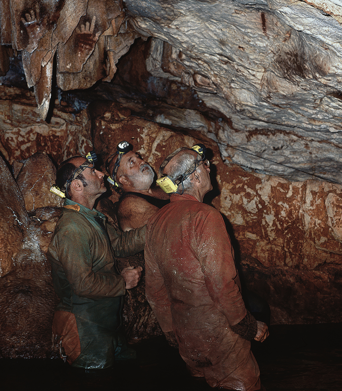 Luc Vanrell, Jean Courtin & Jean Clottes examining engravings in the Cosquer Cave