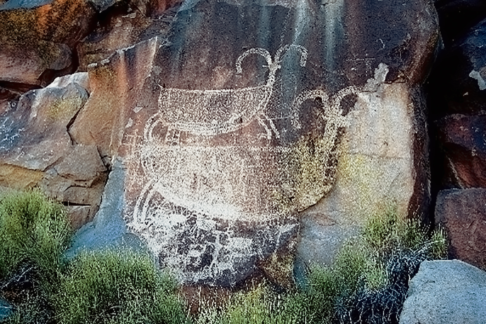 The larger of these two bighorn sheep in Petroglyph Canyon is greater than 7 feet from tip of horn to tip of tail