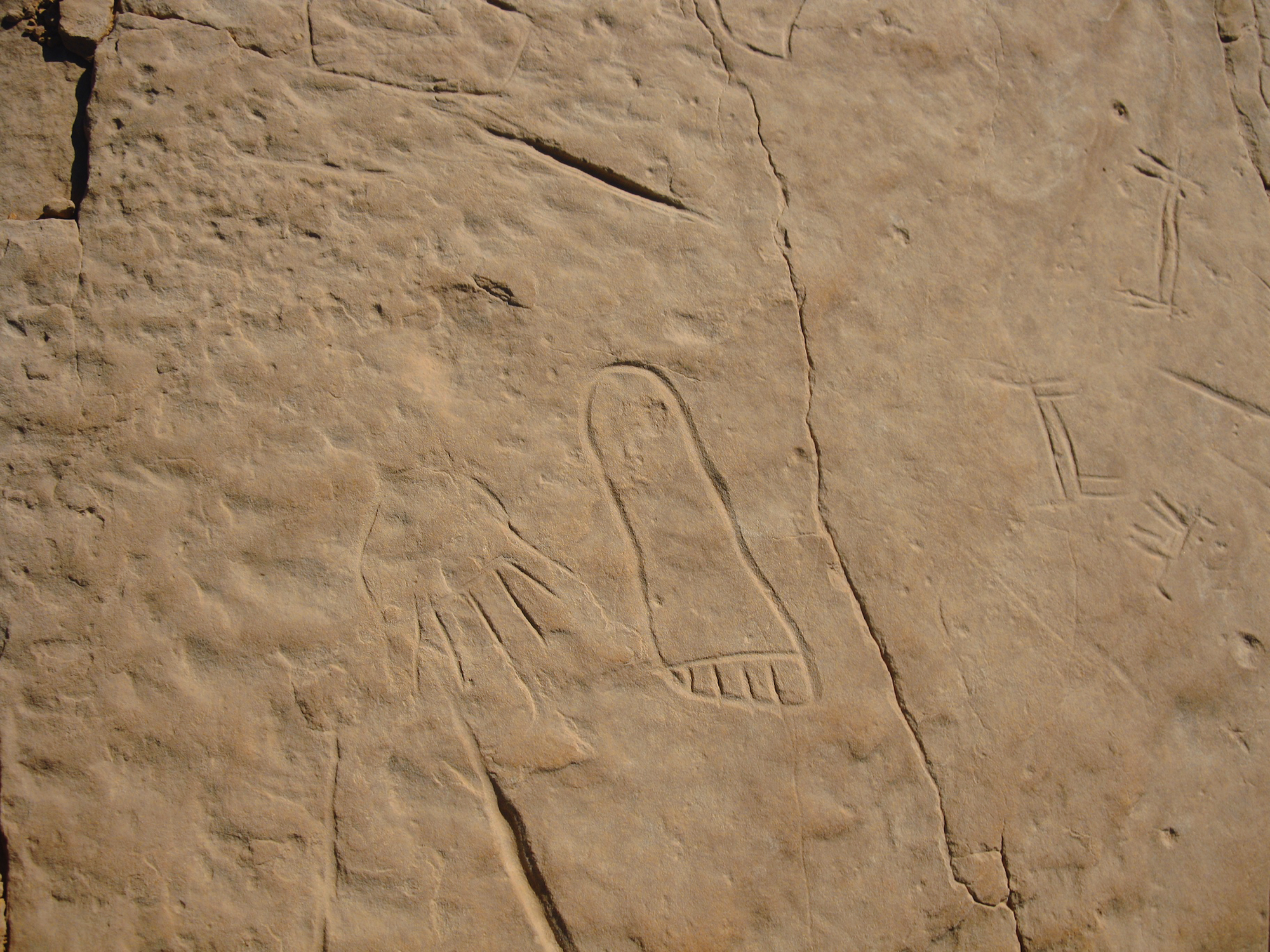 Rock Art Hand and foot, possibly belonging to the same individual, incised on a sandstone massif in Egypt’s Western Deserts Archaeology Egypt