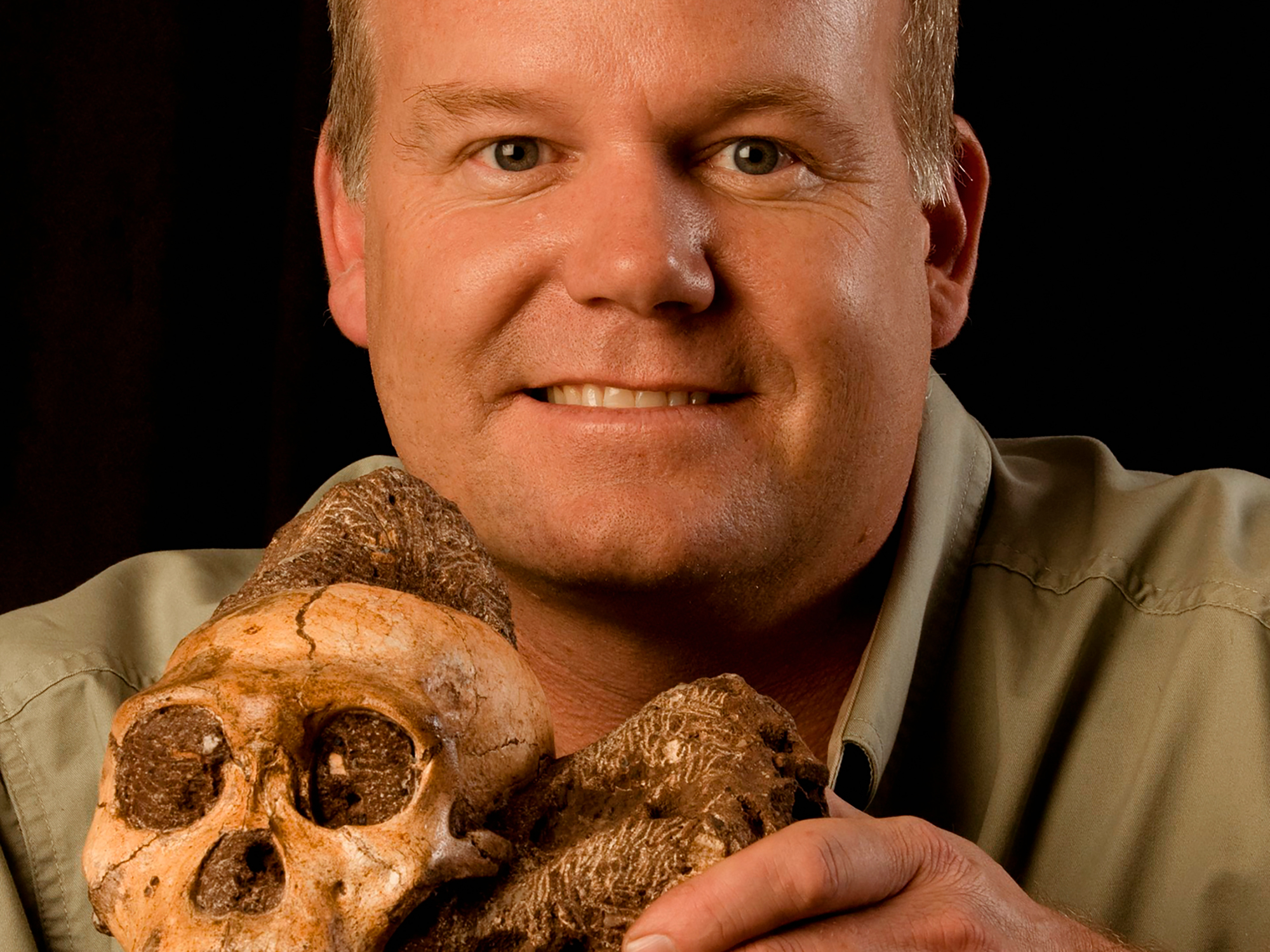 Professor Lee Berger with Australopithecus sediba