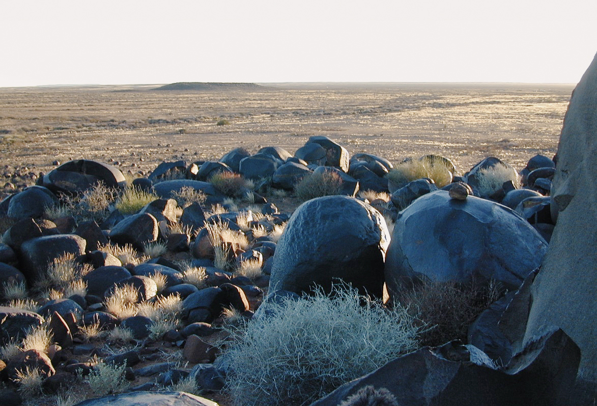 Dolerite boulders on the hill known today as Tafelkop, and the flat country beyond