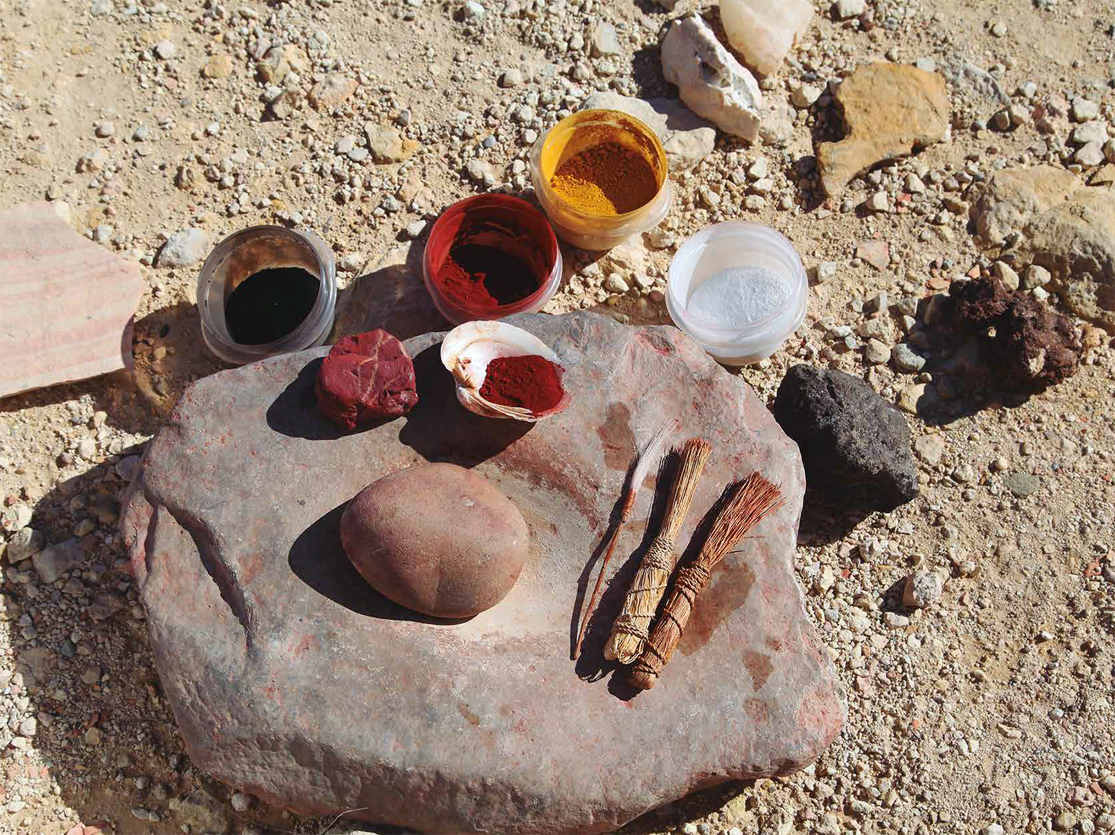 Grinding stone, mineral pigments, and brushes made from fiber and animal hair used in experimental paint-making