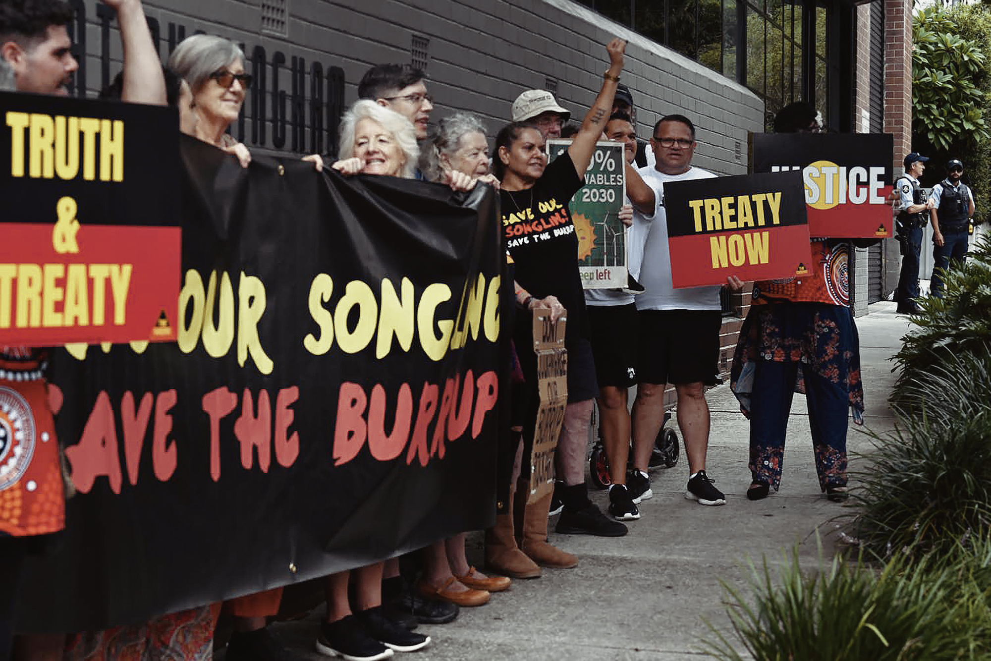 Protestors outside the Environment Minister Tanya Plibersek’s office in Sydney as part of their campaign to protect sacred Murujuga rock art from industrial developers